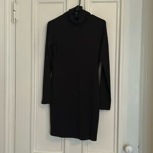 Large sized turtleneck sweater dress with long sleeves